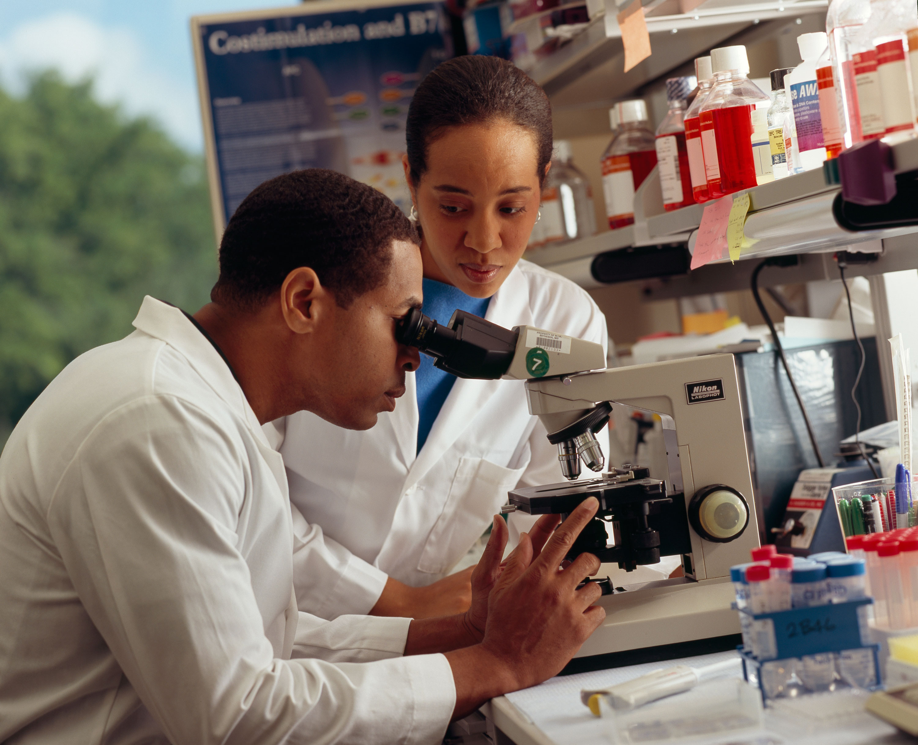 Researcher looking through microscope.jpg